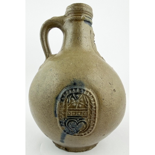 122 - BELLARMINE JUG. 8ins tall. Dark salt glaze finish, bulbous body. Familiar bearded face sprig below n... 