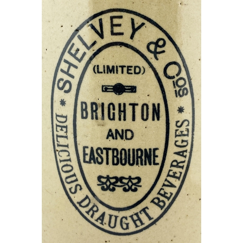 129 - BRIGHTON & EASTBOURNE DOUBLE SIDED FLAGON. 20ins tall. Black transfer, handle either side, metal han... 