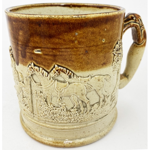 63 - GREYHOUND HANDLED MUG. 5.4ins tall, t.t. Five applied hunting scene sprigs. Tooled base, minor damag... 