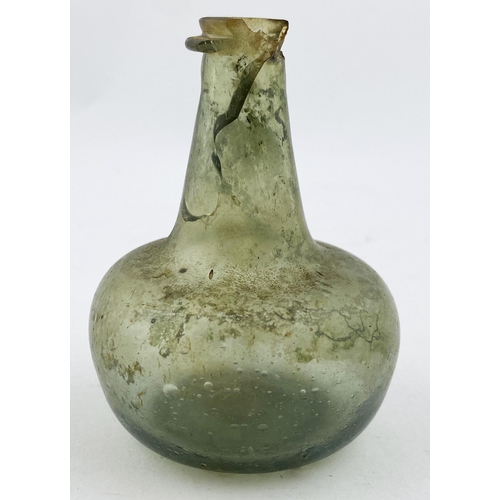 132 - MINIATURE SHAFT & GLOBE BOTTLE. 3ins tall. A mini shaft & globe form in a quite pale green tinged gl... 