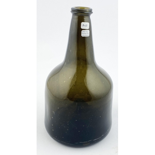 134 - ENGLISH TRANSITIONAL MALLET BOTTLE. 6.2ins tall. Delightful deep green/ black glass, many bubbles. W... 