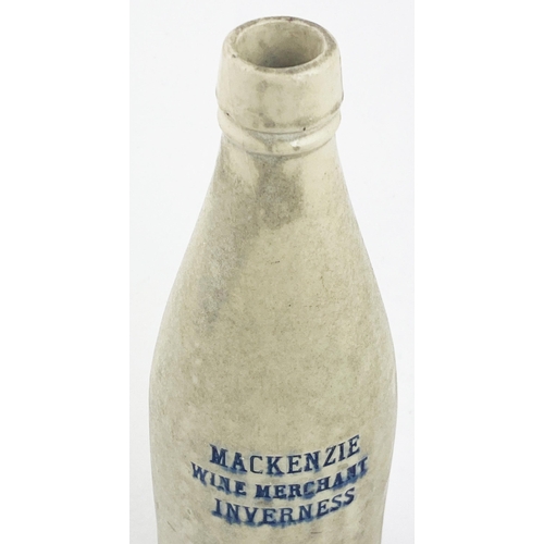 153 - INVERNESS MACKENZIE GINGER BEER BOTTLE. 8.6ins tall, ch., all white , square shaped lip. Three impre... 