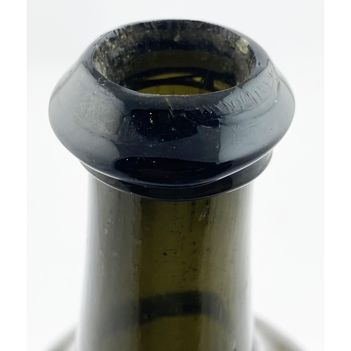 211 - ENGLISH SPLIT SIZE SEALED CYLINDER WINE BOTTLE. 10.4ins tall. Deep olive green/ black glass, rounded... 