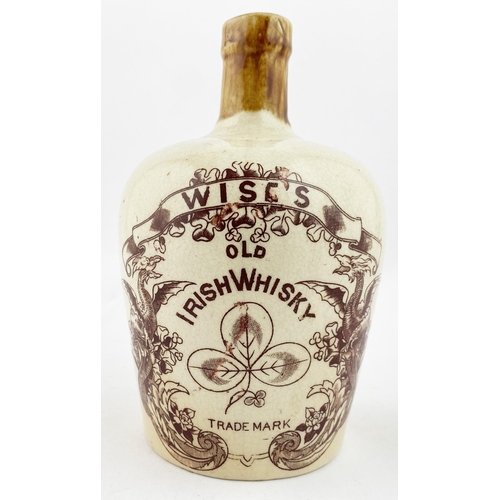 214 - WISES OLD IRISH WHISKY JUG. WG p215. 7.7ins tall, rear handle. Very ornate serpents & floral surroun... 