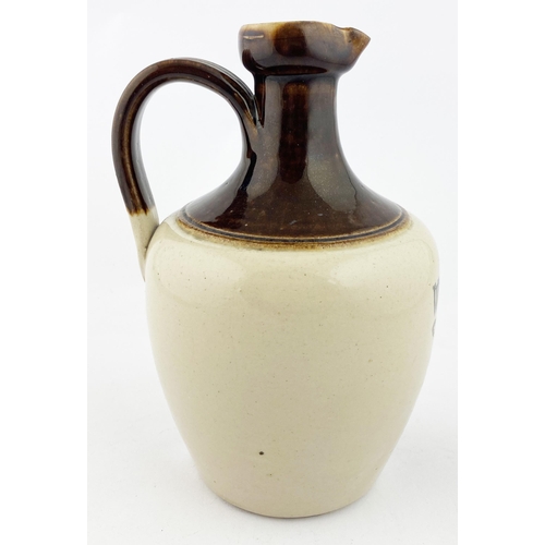 217 - WATSONS DUNDEE WHISKY JUG. WG p202. 8.6ins tall, rear handle. Crisply struck black pict. transfer of... 