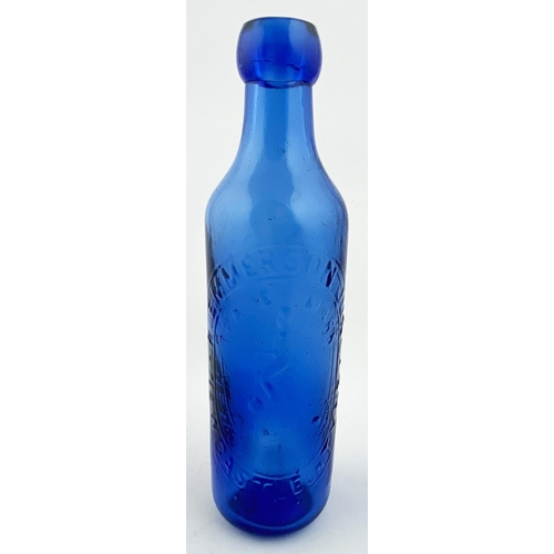 21 - NEWCASTLE BLUE CYLINDER BOTTLE. 8.5ins tall. Bright cobalt blue glass upright 10oz cylinder, blob to... 