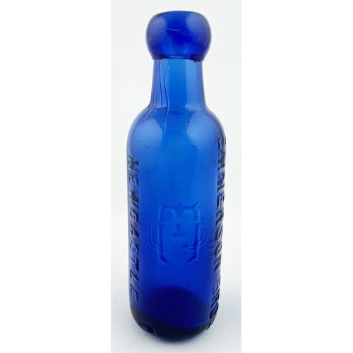 22 - NEWCASTLE BLUE CYLINDER BOTTLE. 6.5ins tall. Upright 6oz cobalt blue glass cylinder, blob top. Two e... 