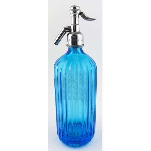 55 - BURY ST EDMUNDS SODA SYPHON. 12ins tall to the top of the trigger. Mid blue glass, vertically facett... 
