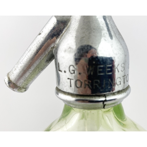 92 - MANCHESTER SODA SYPHON. 12.7ins tall to the top of the trigger. Lime green glass, vertically facette... 