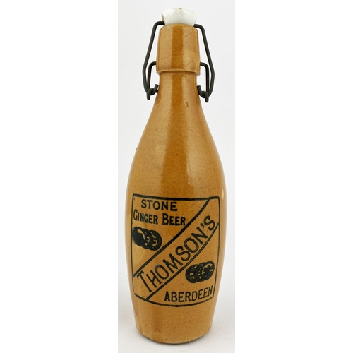 202 - THOMPSONS ABERDEEN SKITTLE SHAPED GINGER BEER BOTTLE. 9.1ins tall, skittle shape, all over orange bo... 