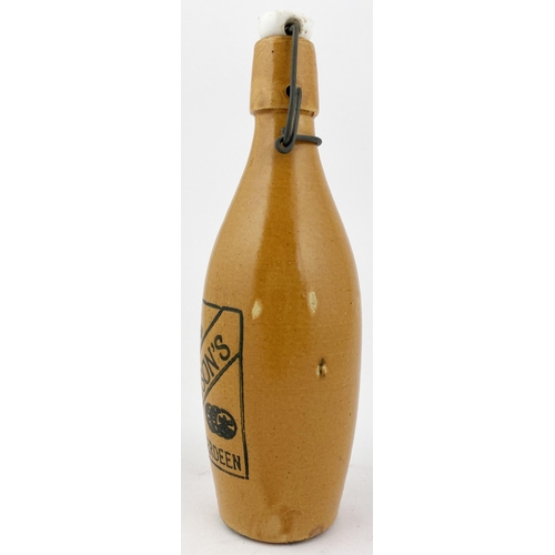 202 - THOMPSONS ABERDEEN SKITTLE SHAPED GINGER BEER BOTTLE. 9.1ins tall, skittle shape, all over orange bo... 