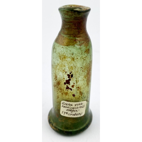 184 - FREE BLOWN APOTHECARY PHIAL. 2.8ins tall, very crude 17th c. greeny tinged glass cylinder, gradually... 