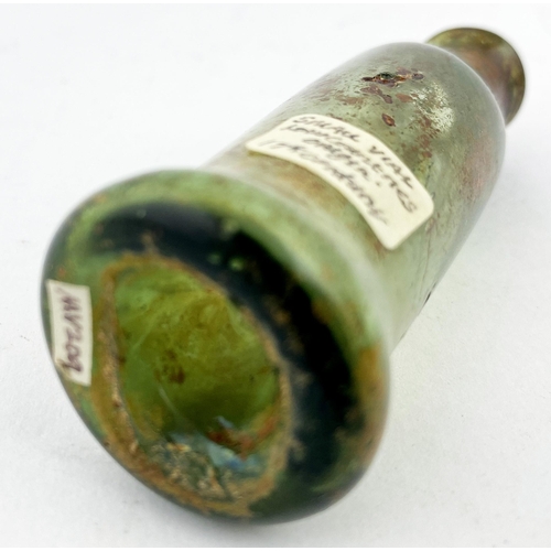 184 - FREE BLOWN APOTHECARY PHIAL. 2.8ins tall, very crude 17th c. greeny tinged glass cylinder, gradually... 