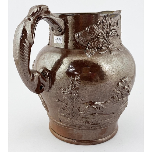 319 - SALTGLAZED SPRIGGED JUG. 8.5ins tall. Shiny glaze with coat of arms to front, greyhound handle, face... 