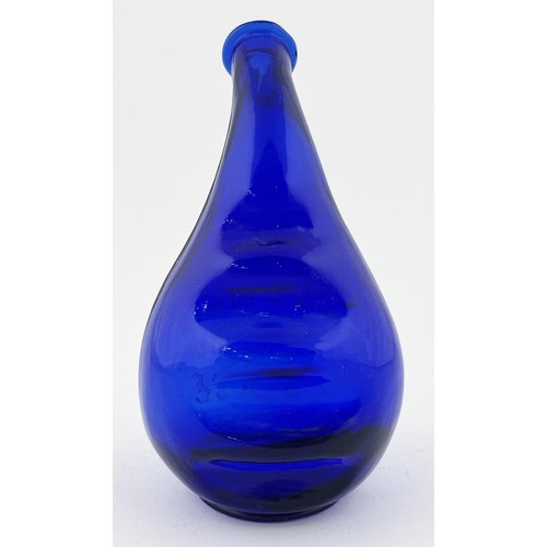 327 - CREMEX SHAMPOOING VASE. 7.5ins tall. Cobalt blue glass, embossed to front, ribbed back. Slight ding ... 