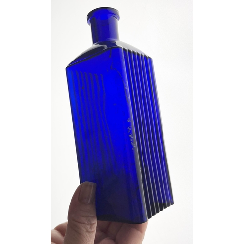 367 - SHEFFIELD CORPORATION POISON BOTTLE. 7ins tall. Square body, embossed to front panel, ribbed to eith... 