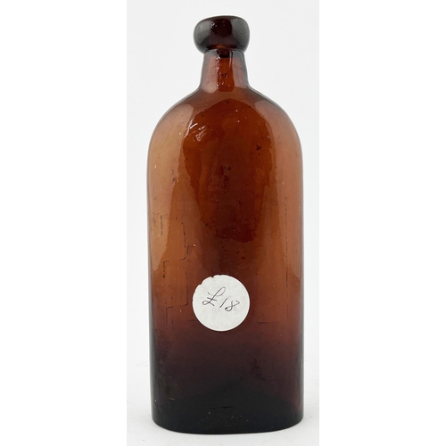 374 - WARNERS SAFE CURE BOTTLE. 9ins tall. Deep red glass, embossing to front with familiar safe motif, Lo... 