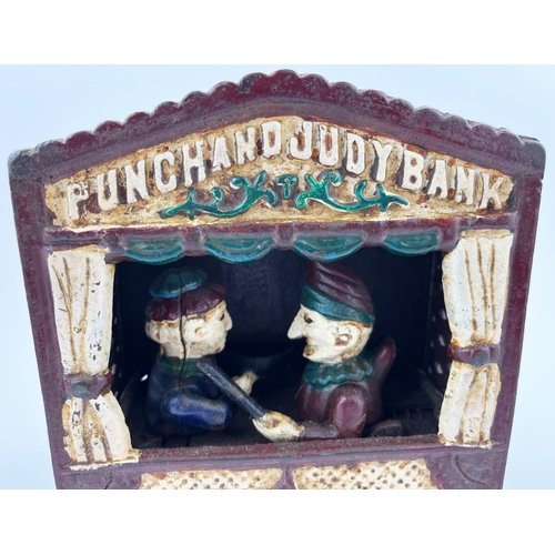 632 - CAST IRON PUNCH & JUDY MONEY BANK. 7ins tall. Hand painted. Great item. Worn.