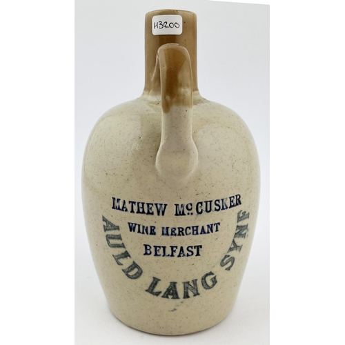 657 - AULD LANG SYNE WHISKY JUG. 4.25ins tall. Double sided, rear handle, impressed rear MATHEW McCUSKER/ ... 