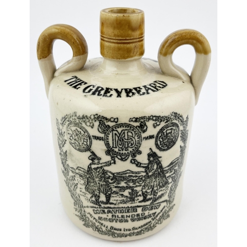 658 - GREYBEARD WHISKY JUG. 6.5ins tall. Double sided, side handles, base p.m. Minor lip nick.