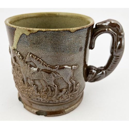 661 - SALT GLAZE HUNTING SCENE MUG. 4.25ins tall. Sprigged with grey hound handle. Base rim chips.