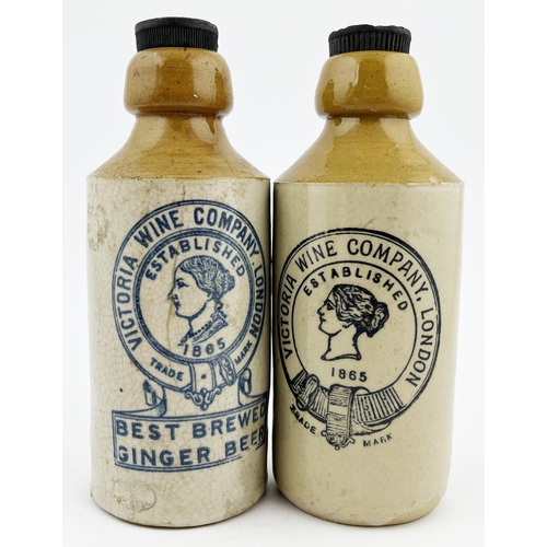 675 - VICTORIA WINE COMPANY GINGER BEER DUO. Tallest 7ins. Ladies head within buckled belt to centre, rear... 