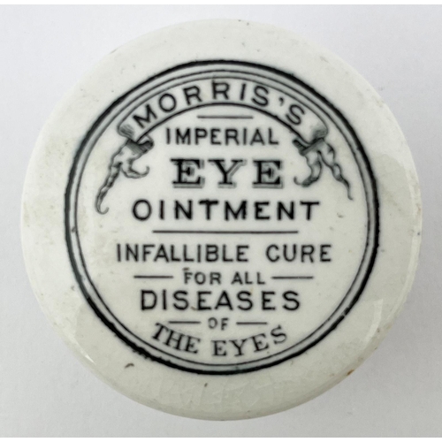 676 - MORRIS EYE OINTMENT LID & BASE. 1.75ins diam. Black transfer, lovely little lid. Under edge nibbles.