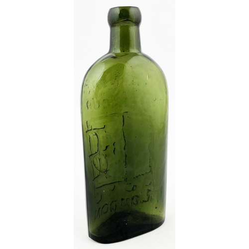 639 - WARNERS SAFE CURE BOTTLE. 7.25ins. Olive green glass, embossed LONDON with familiar safe motif. Mint... 