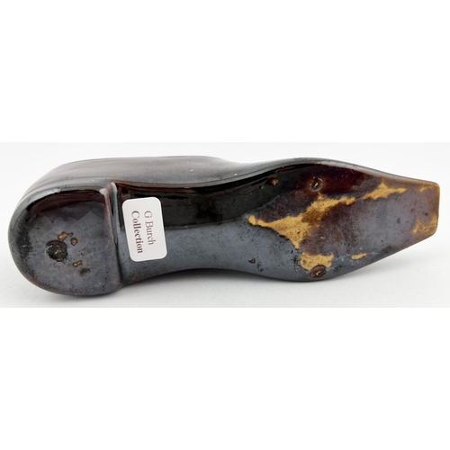 662 - SHOE INKWELL. 1.75ins tall. Treacle glaze shoe shaped inkwell, with pen holes to top. Minute nibbles... 