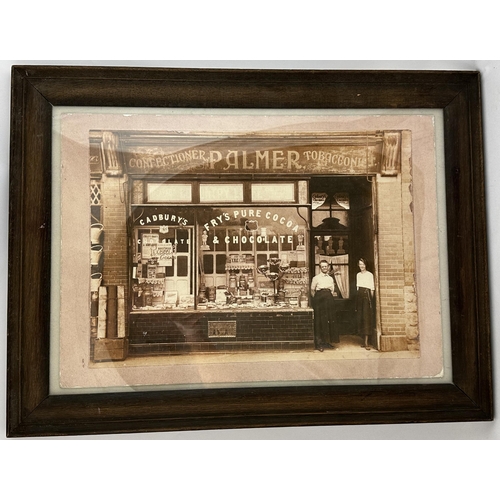 9 - PALMERS SHOP FRONT EARLY FRAMED PHOTOGRAPH. 23.25 x 17.5ins. Sepia/ black & white shop front photogr... 