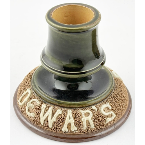 127 - DEWARS MATCHSTRIKER MATCH HOLDER & ASHTRAY. 5.7ins diam. Salt glazed stoneware wide dish with centra... 