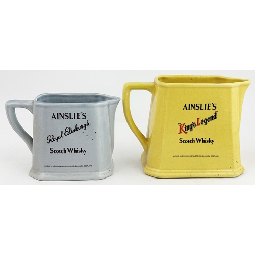 109 - AINSLIES WATER JUG DUO. Tallest 5ins. Double sided, ROYAL EDINBURGH & KINGS LEGEND, side handle. Som... 