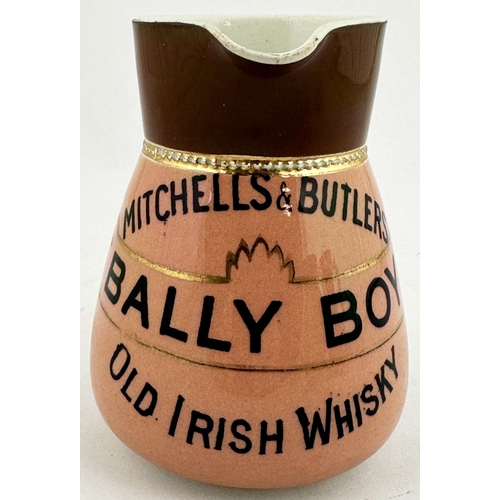 204 - MITCHELL & BUTLERS DUMBARTON OLD IRISH WHISKY WATER JUG. 4.5ins tall. Rear handle, pink body, black ... 