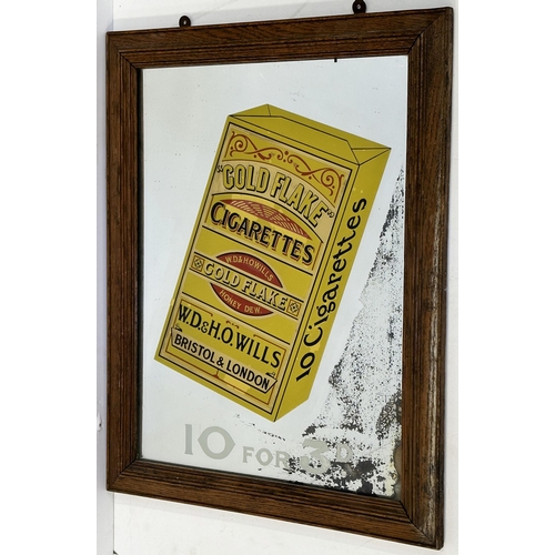 234 - WILLS GOLD FLAKE FRAMED MIRROR. 18 x 23ins. Yellow packet of cigarettes to centre with price underne... 