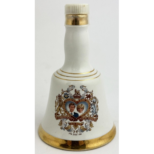 243 - MINIATURE 1981 BELLS DECANTER. 4ins tall. Marriage of Charles & Lady Diana. Wade base p. m. With con... 