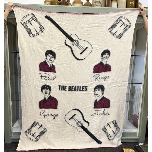 252 - BEATLES BLANKET. 62.5 x 77ins. Fleecey woollen blanket carrying faces of the fab four band plus musi... 