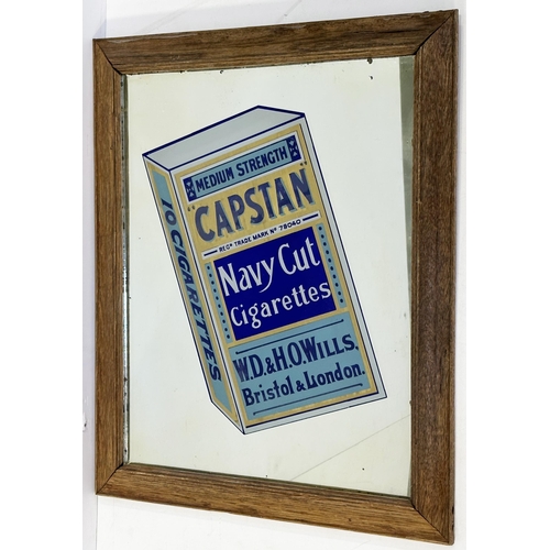 233 - WILLS CAPSTAN CIGARETTES FRAMED MIRROR. 18.25 x 22.5ins. Blue & gold packet of cigarettes to centre.... 