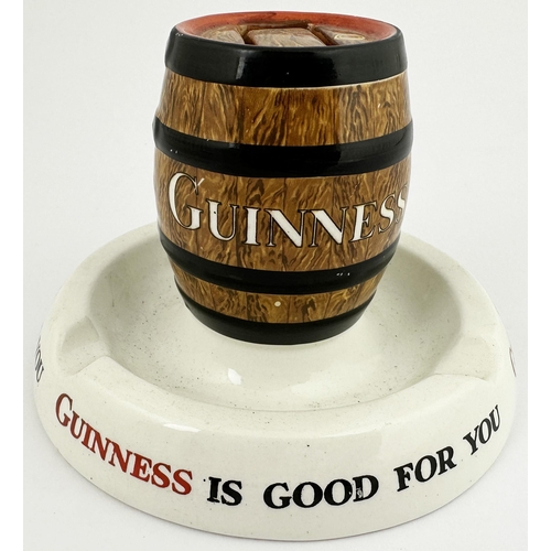 289 - GUINNESS MATCH HOLDER/ ASHTRAY. 3.75ins tall. Circular base with lettering around, barrel to middle ... 