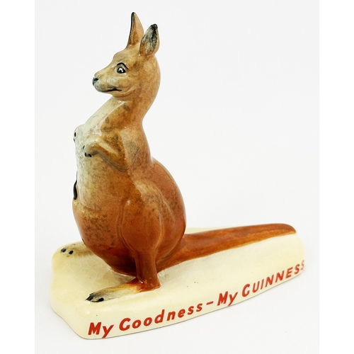 294 - KANGAROO PROMOTIONAL MINIATURE FIGURE. 4ins tall. Bottle of Guinness in pouch. Red Carltonware base ... 