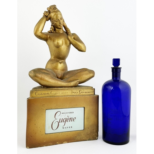 308 - EUGENE ADVERTISING STATUETTE & BOTTLE. Figure 18 ins tall, cobalt bottle 10.8ins to stopper top. Pla... 