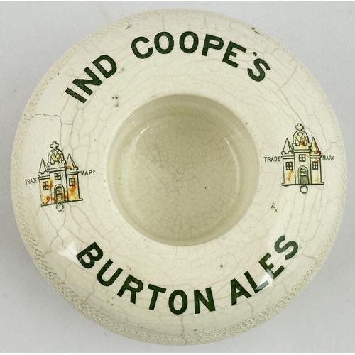 309 - IND COOPES BURTON ALES MATCHHOLDER & STRIKER. 4.8ins diam. Heavy tyre style, green and (worn) red tr... 