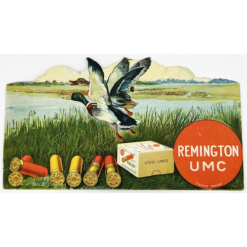 323 - REMINGTON CARTRIDGES CUT OUT HANGING SHOWCARD. 12.2 x 6.8ins. Multi coloured image of cartridges lai... 