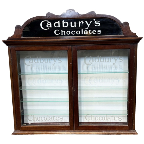 334 - CADBURYS CHOCOLATES FRONT LOADING DISPLAY CABINET. 32.5 x 31.75 x 6.25ins. Dark wood. Top pediment f... 