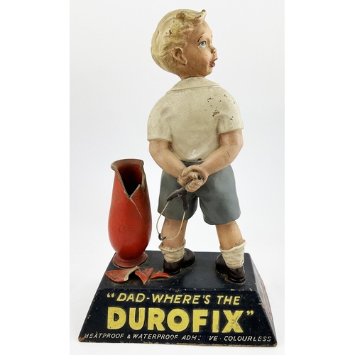 356 - DUROFIX LARGE ADVERTISING FIGURE. 17ins tall. Impressive painted rubberoid figure of small boy holdi... 