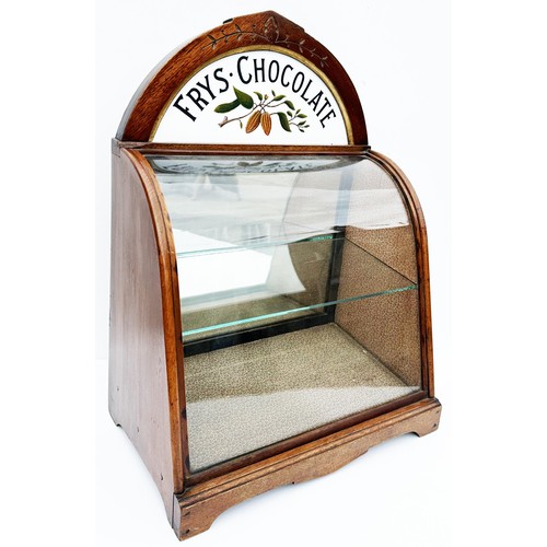 366 - FRYS SMALL SIZE CHOCOLATE CABINET. H 18.75 x W 8.5 x L 14ins. Curved glass fronted cabinet with curv... 