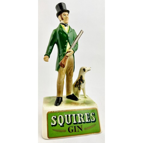 254 - SQUIRES GIN ADVERTISING STATUETTE. 10.2ins tall. Naturalistically colopured full figure period dress... 