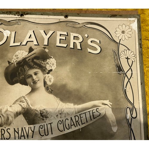 37 - PLAYERS NAVY CUT CIGARETTES FRAMED SHOWCARD. 13.5 x 21ins. Black & white hatted lady to centre holdi... 