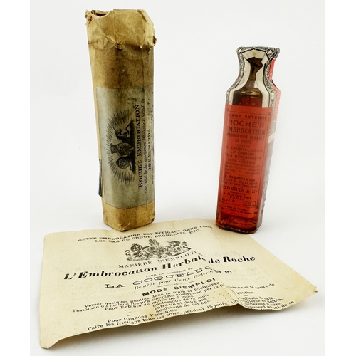 46 - ROCHES EMBROCATION FULL & LABELLED BOTTLE WITH ORIGINAL WRAPPINGS. Bottle is 4.9ins tall, aqua glass... 