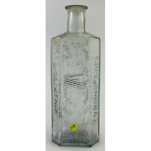 48 - HOLDENS TOMMY BOTTLE. 5.5ins, pale ice blue glass, rectangular body, chamfered corners. Embossed HOL... 