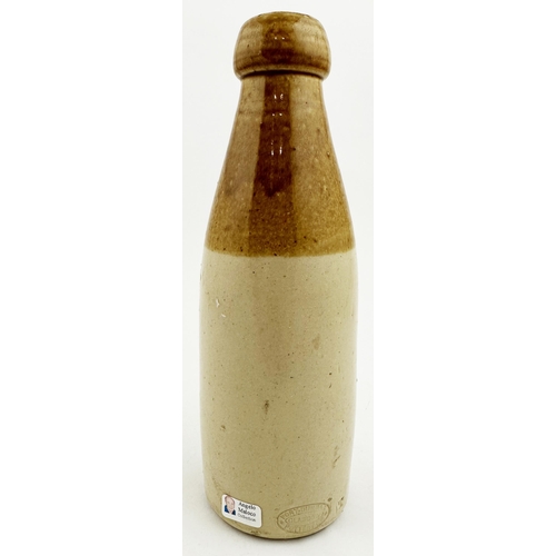 54 - JAMES GOWS DUNDEE GINGER BEER BOTTLE. 7.9ins tall, ch., t.t., cork blob lip. Hand holding what looks... 